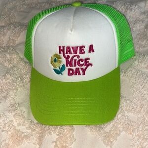Neon green “have a nice day” trucker hat